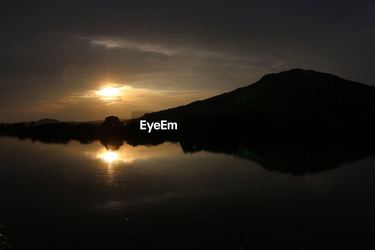 Silhouette mountain against sky at sunset