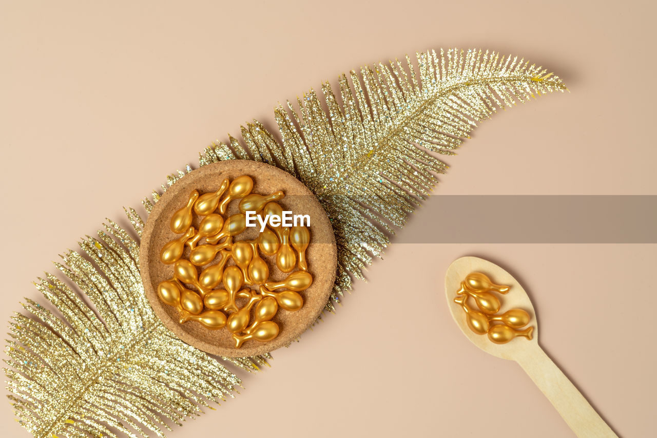 fashion accessory, gold, jewellery, studio shot, indoors, colored background, no people, yellow