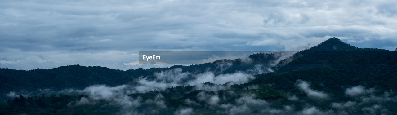 cloud, mountain, environment, sky, scenics - nature, landscape, mountain range, beauty in nature, nature, land, fog, panoramic, forest, travel, tree, mountain peak, no people, plant, travel destinations, outdoors, tourism, ridge, cloudscape, tranquility, non-urban scene, dramatic sky, pinaceae, tranquil scene, overcast, trip, pine tree