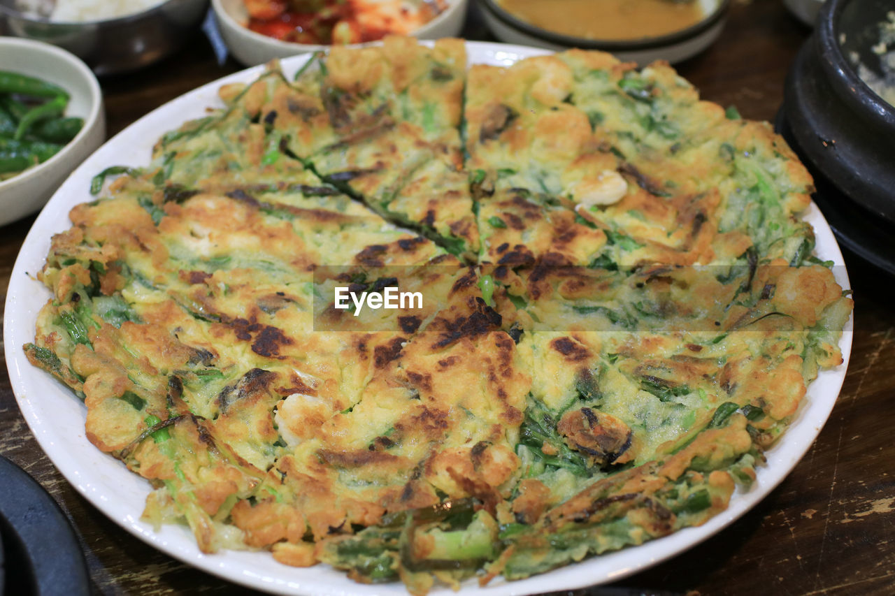 food and drink, food, freshness, dish, healthy eating, cuisine, meal, wellbeing, asian food, plate, no people, produce, table, vegetable, close-up, indian food, indoors, still life, high angle view, frittata, breakfast, business