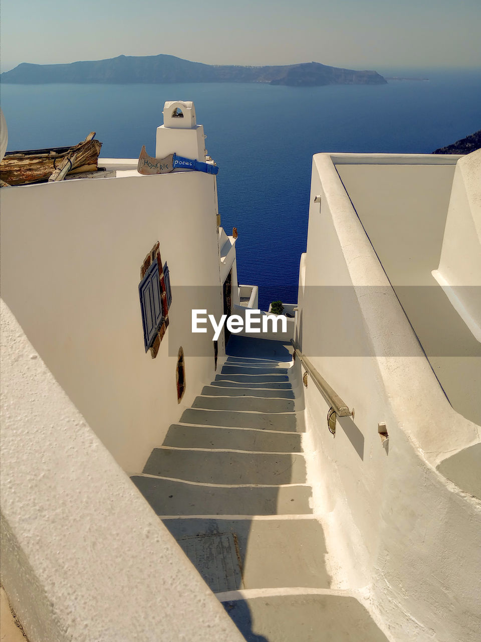 High angle view of staircase, buildings in front of sea