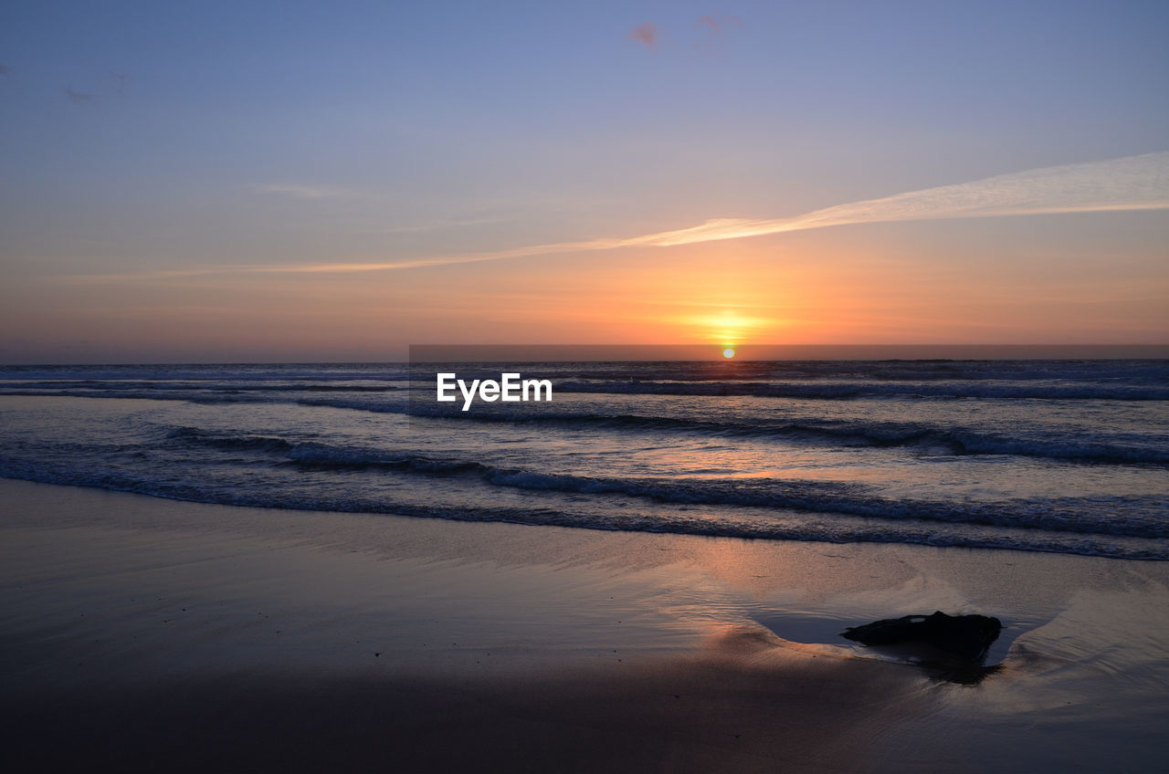 sky, sea, sunset, water, beauty in nature, scenics - nature, land, ocean, beach, tranquility, nature, wave, horizon, tranquil scene, reflection, horizon over water, dawn, sunlight, cloud, shore, no people, sun, body of water, coast, idyllic, motion, wind wave, outdoors, orange color, sand, evening, animal, environment, non-urban scene, animal themes