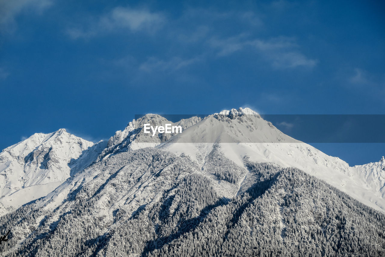 SCENIC VIEW OF SNOWCAPPED MOUNTAIN AGAINST SKY