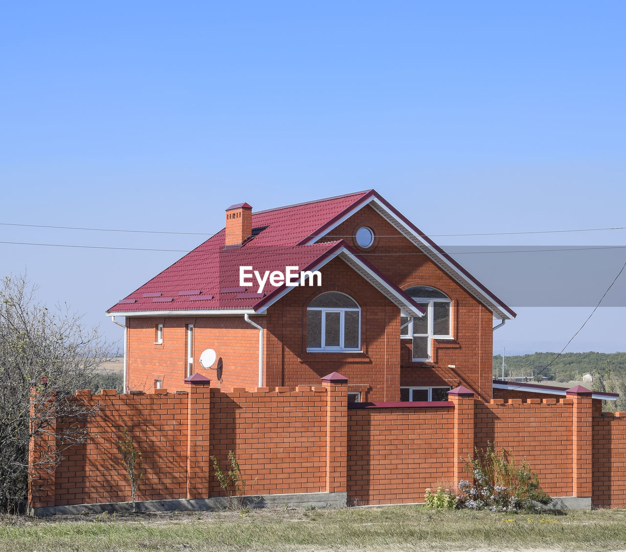 HOUSES AGAINST SKY