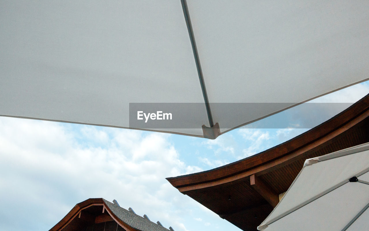 Low angle view of built structure against cloudy sky