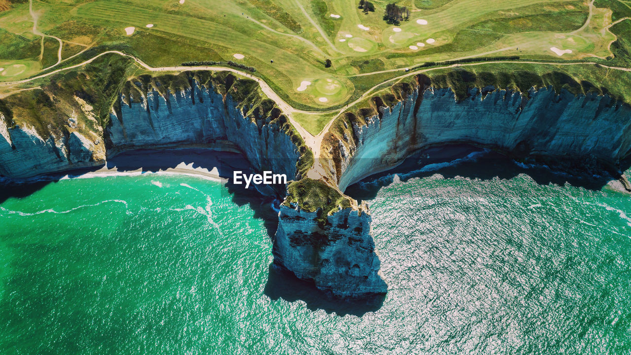 High angle view of rocks by sea