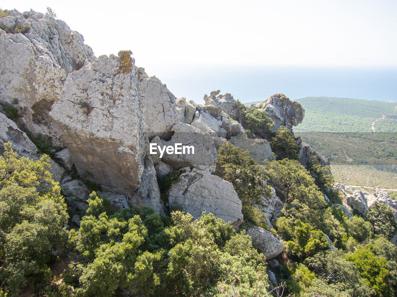 Rocks on mountain against clear sky