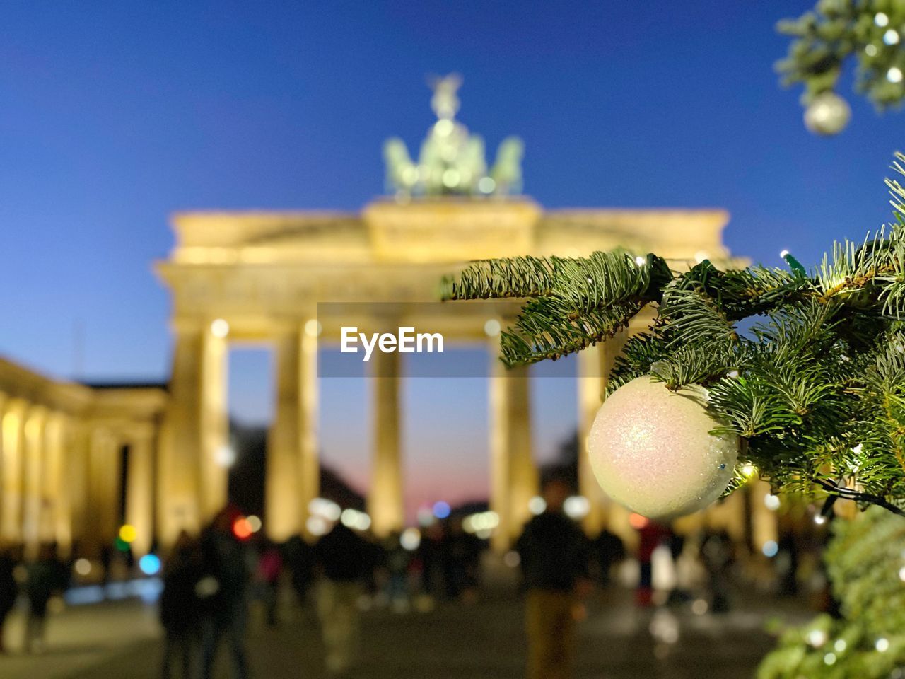 Brandenburg gate in berlin with christmas tree in the foreground