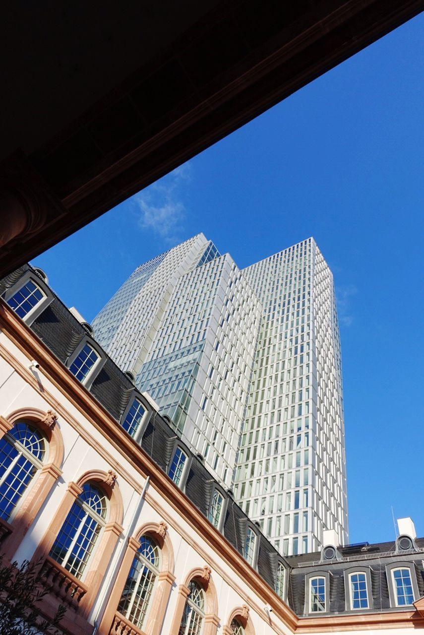 LOW ANGLE VIEW OF MODERN BUILDINGS AGAINST SKY