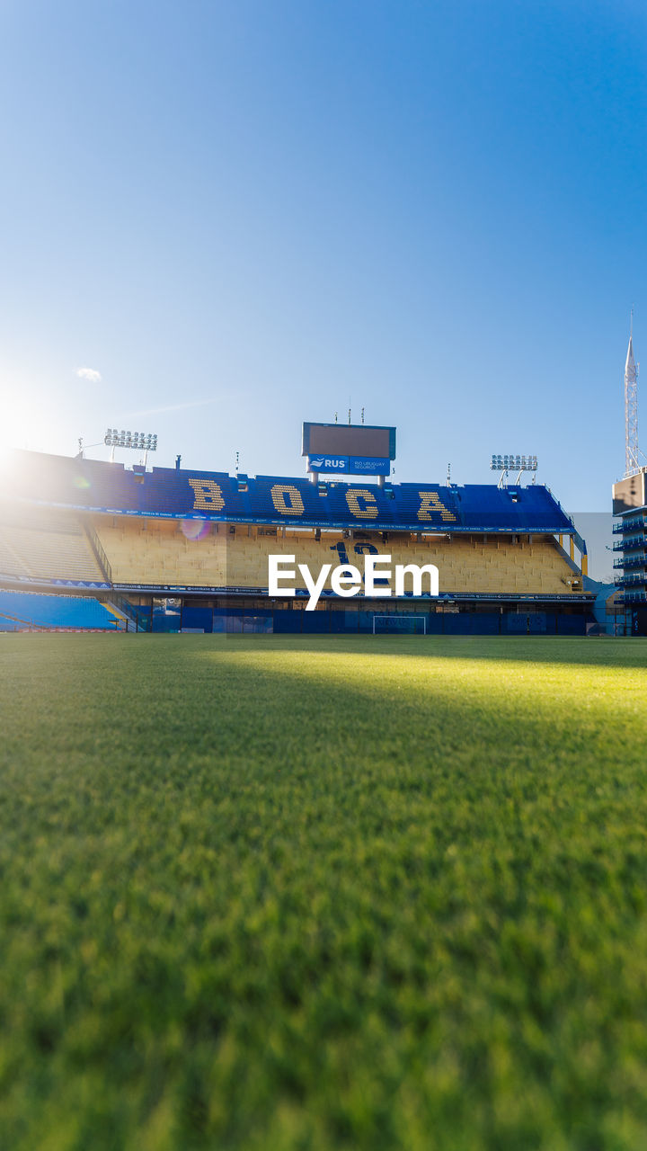 VIEW OF FIELD AGAINST CLEAR SKY