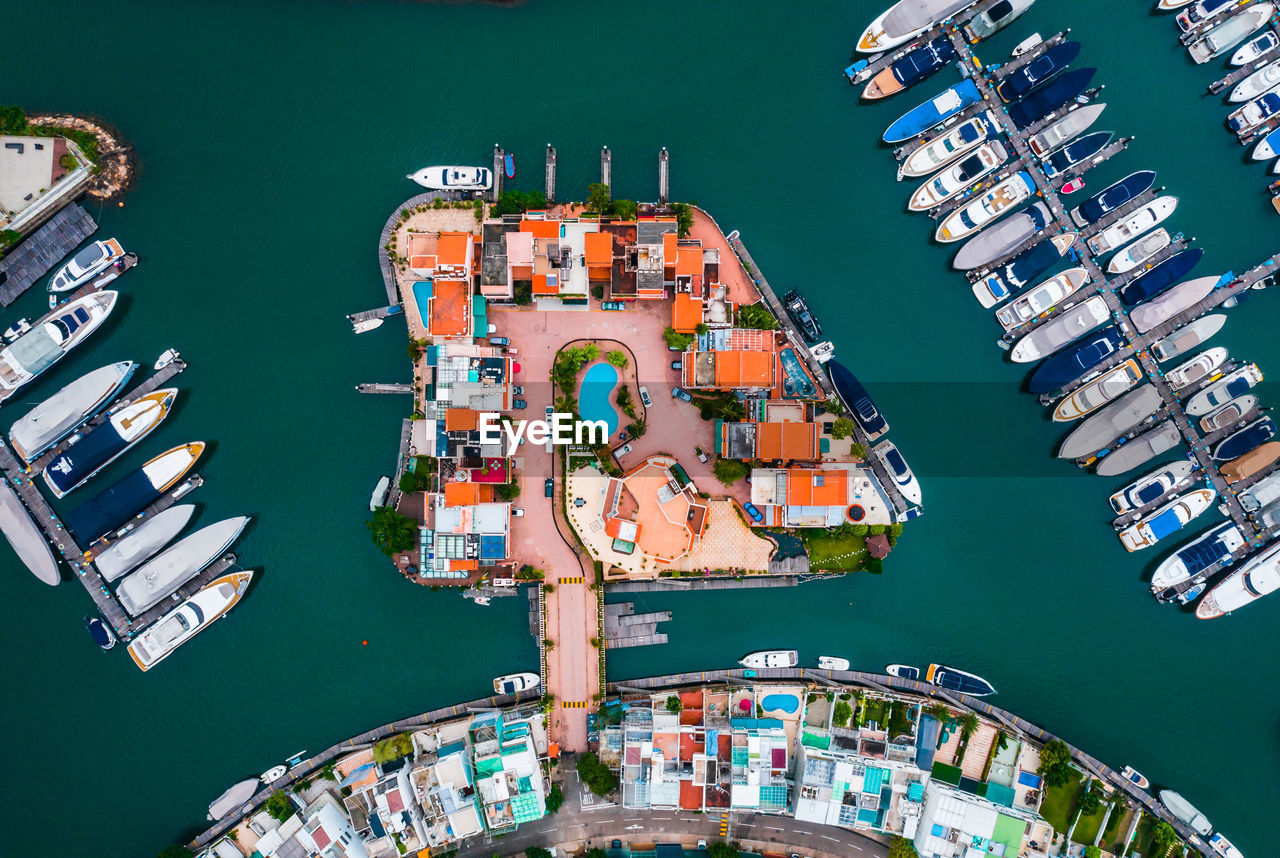 High angle view of boats moored at harbor