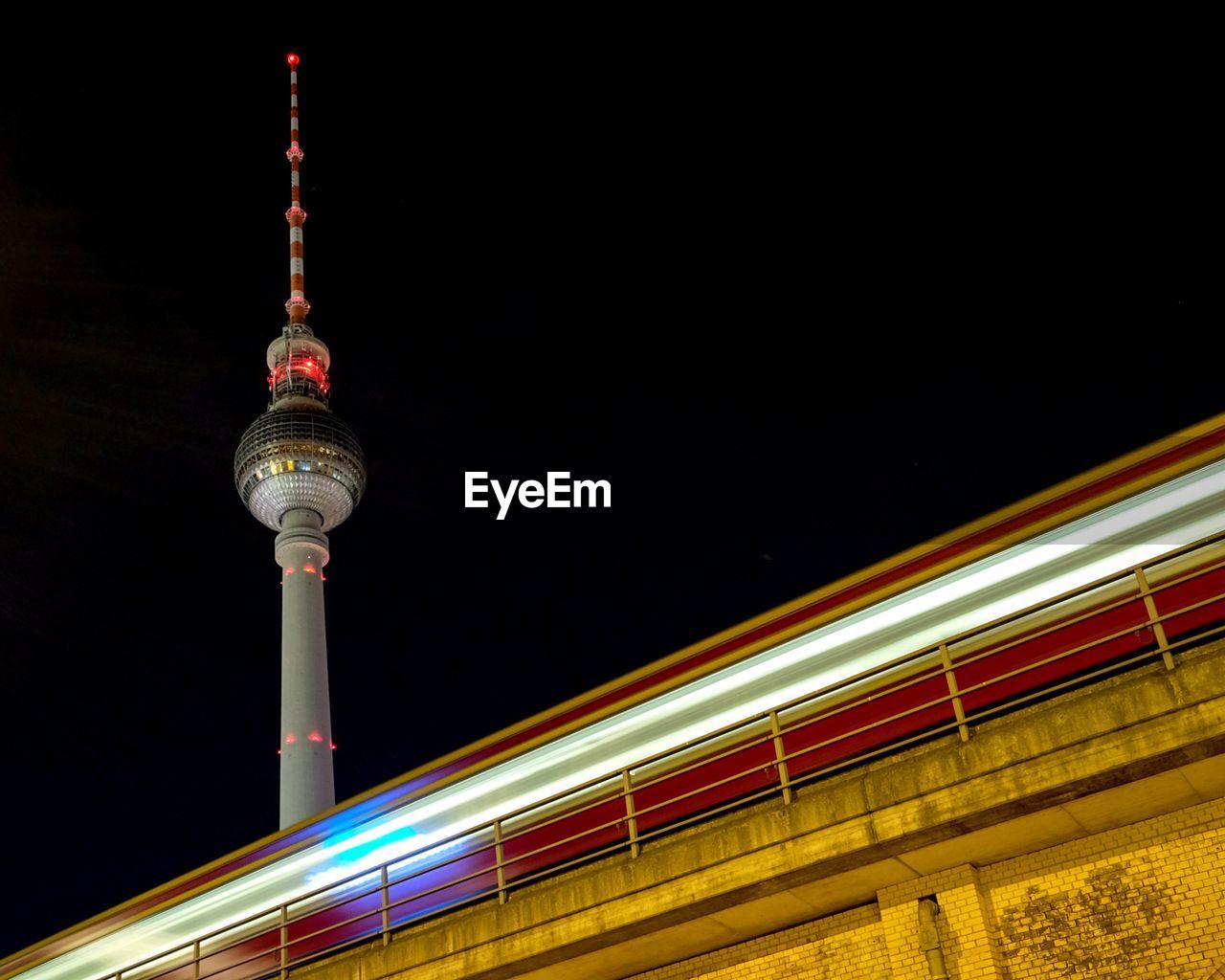 Low angle view of berlin tv tower at night