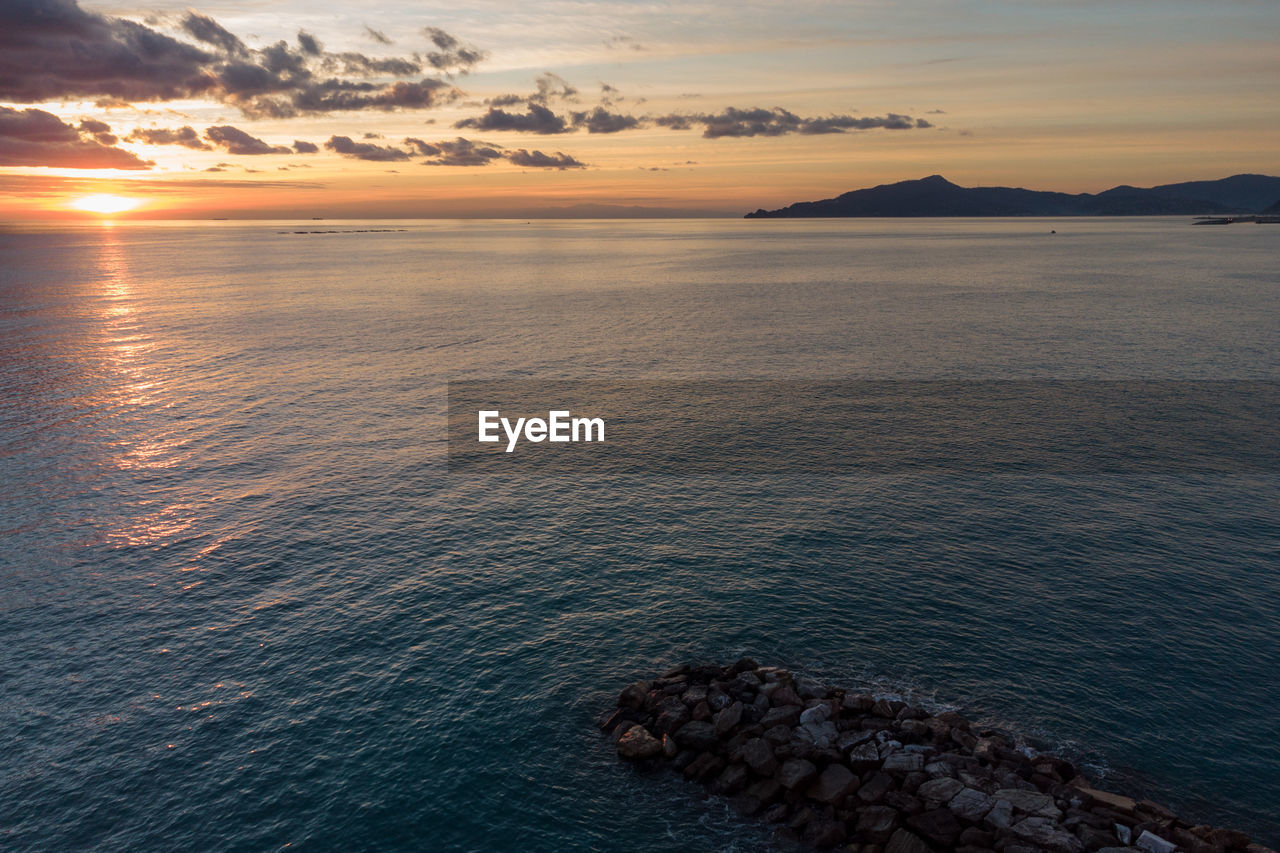 Scenic view of sea against sky during sunset, aerial view, drone photography