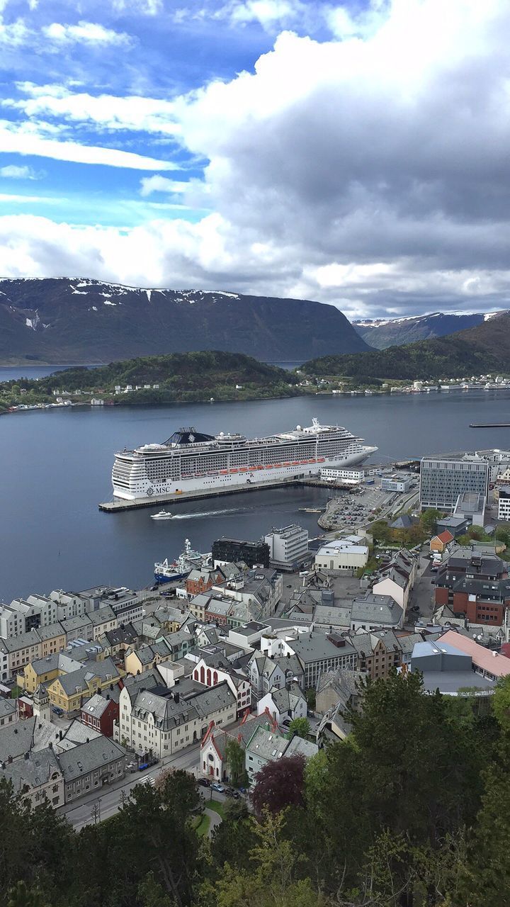 SCENIC VIEW OF SEA AND HARBOR AGAINST SKY