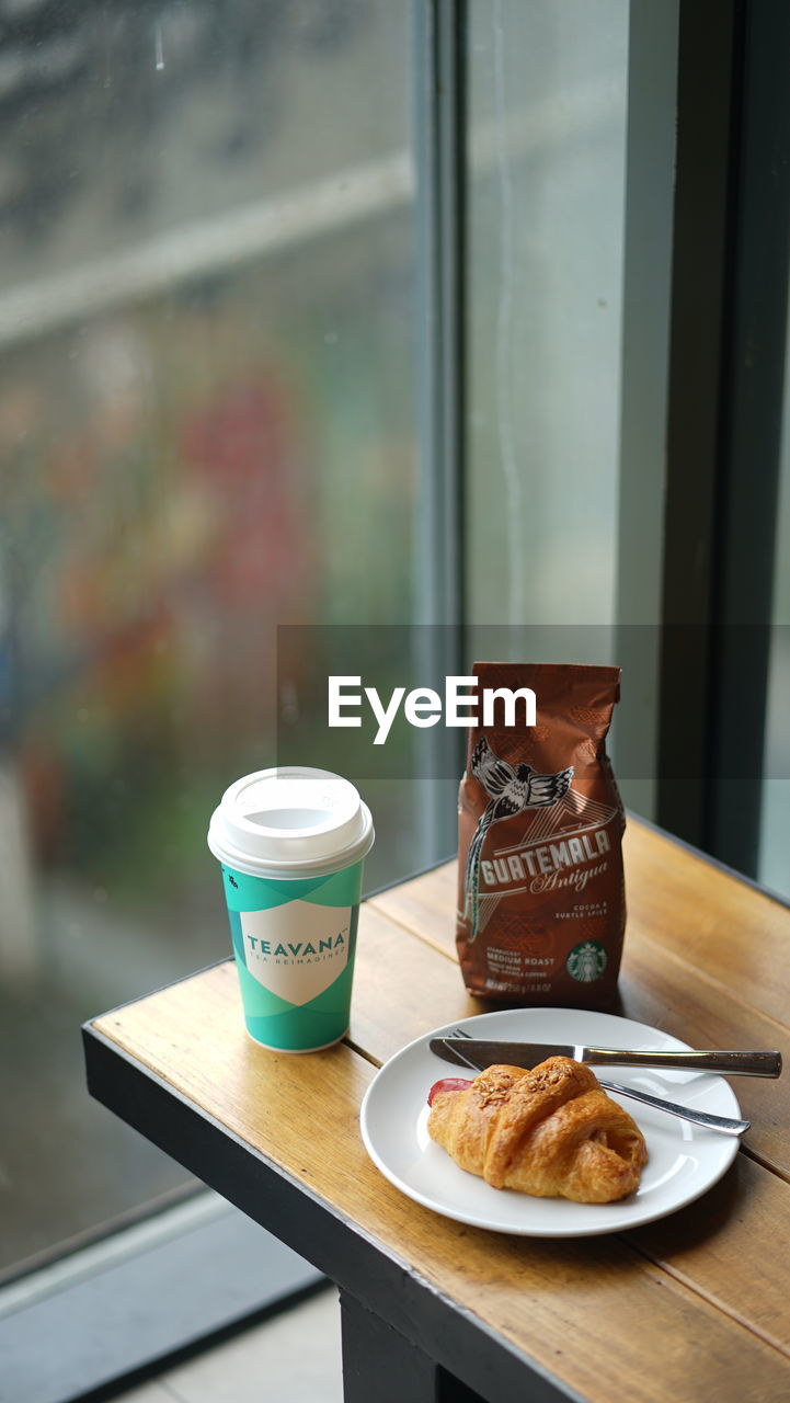 food, food and drink, indoors, dessert, snack, no people, technology, table, coffee, focus on foreground, close-up, baked, still life, communication, cup, day