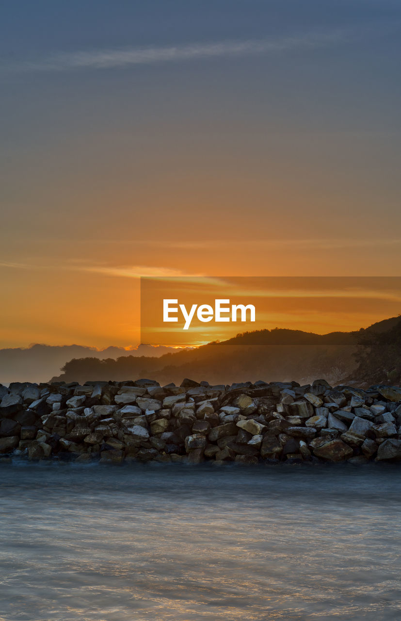 Scenic view of sea against sky during sunset