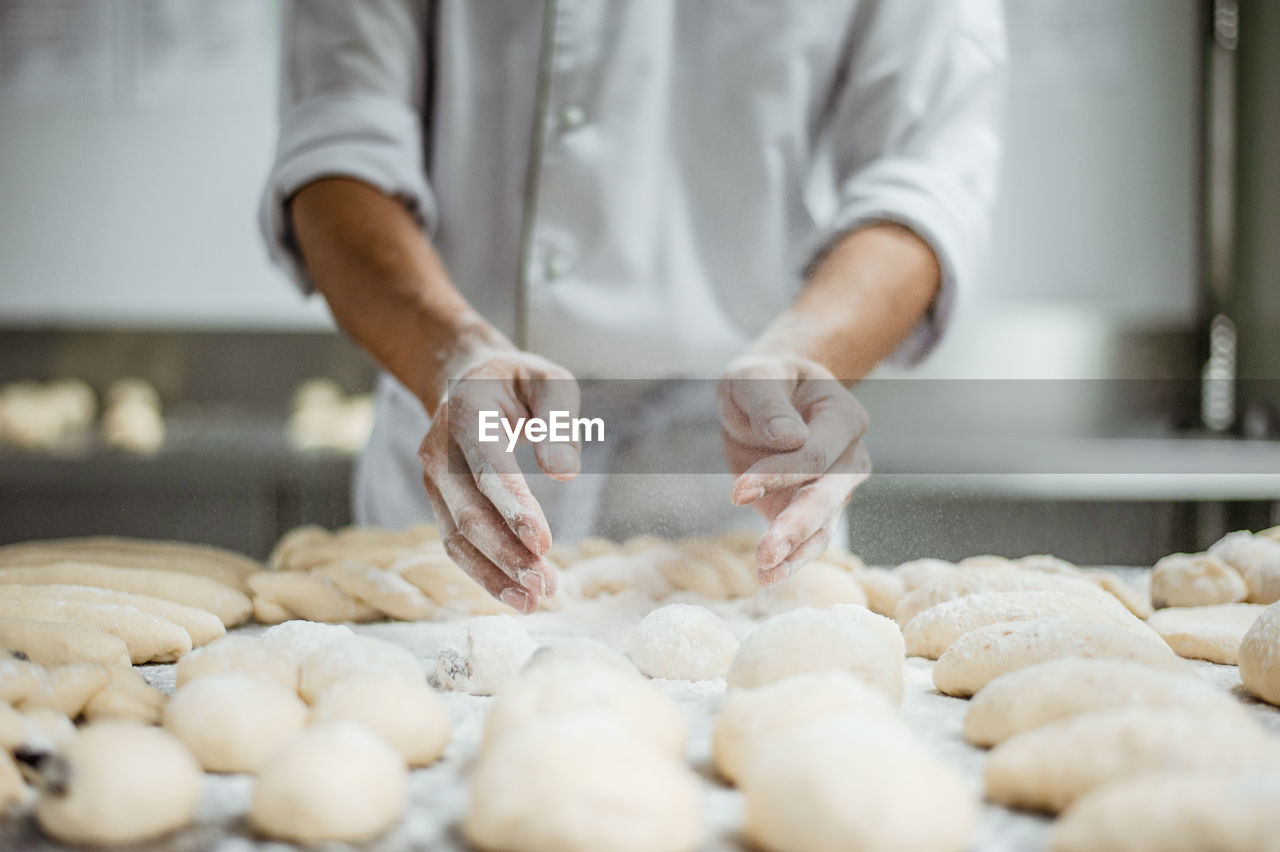 Midsection of man preparing food