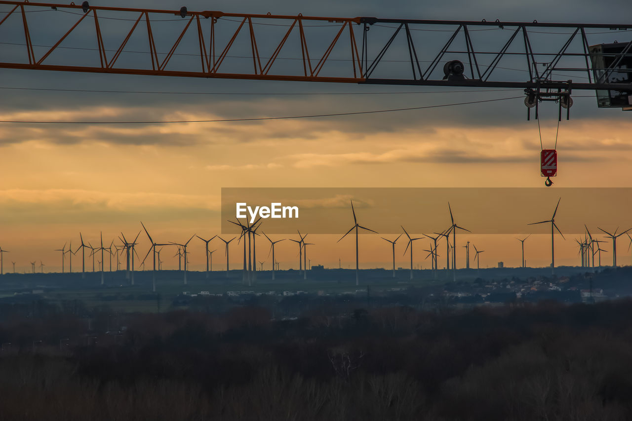 Wind farm or wind farm at sunset in cloudy weather in austria in europe,