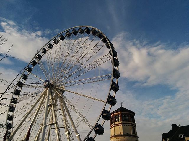 LOW ANGLE VIEW OF FERRIS WHEEL AGAINST THE SKY