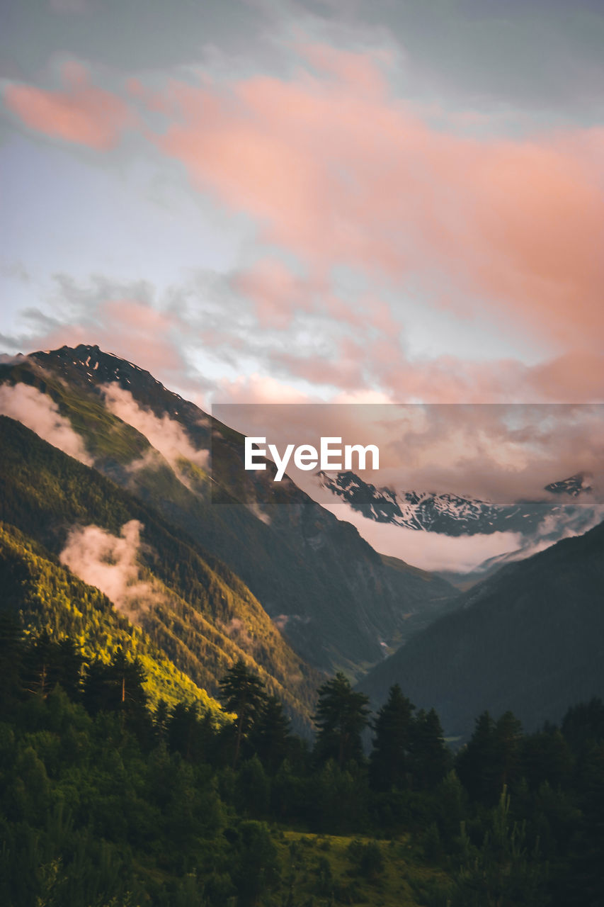 Scenic view of mountains against sky during sunset