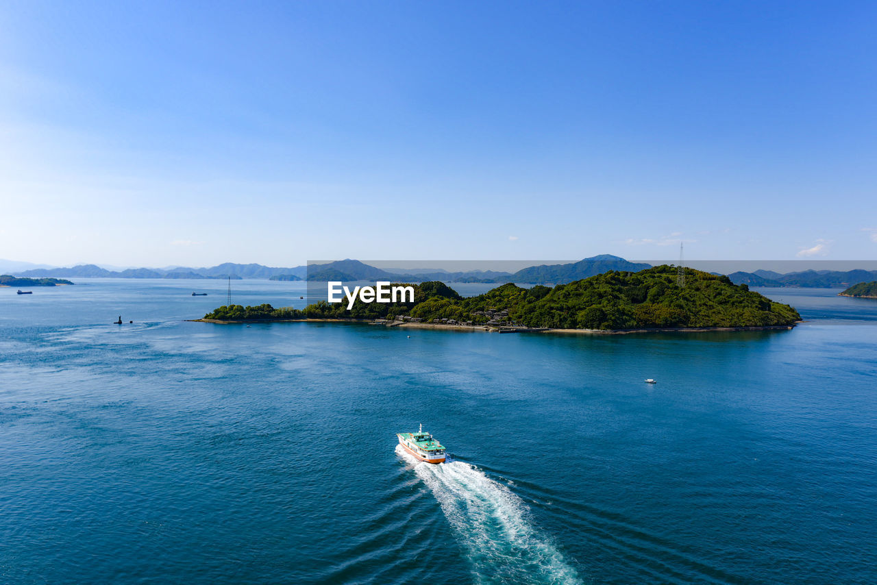 Scenic view of sea against blue sky