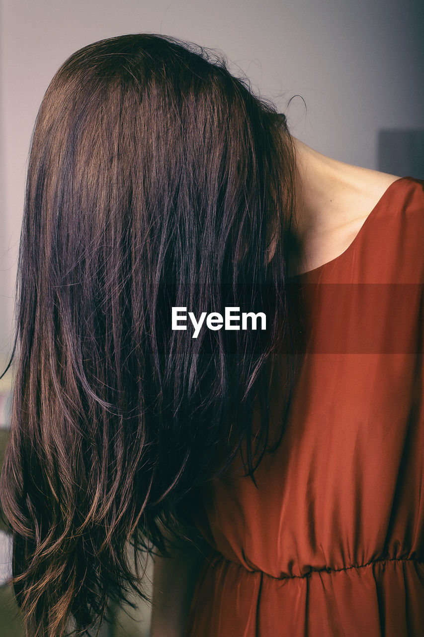 Woman with long hair standing