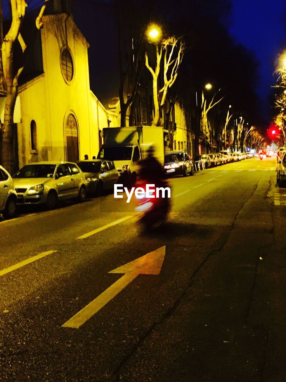 TRAFFIC ON STREET AT NIGHT