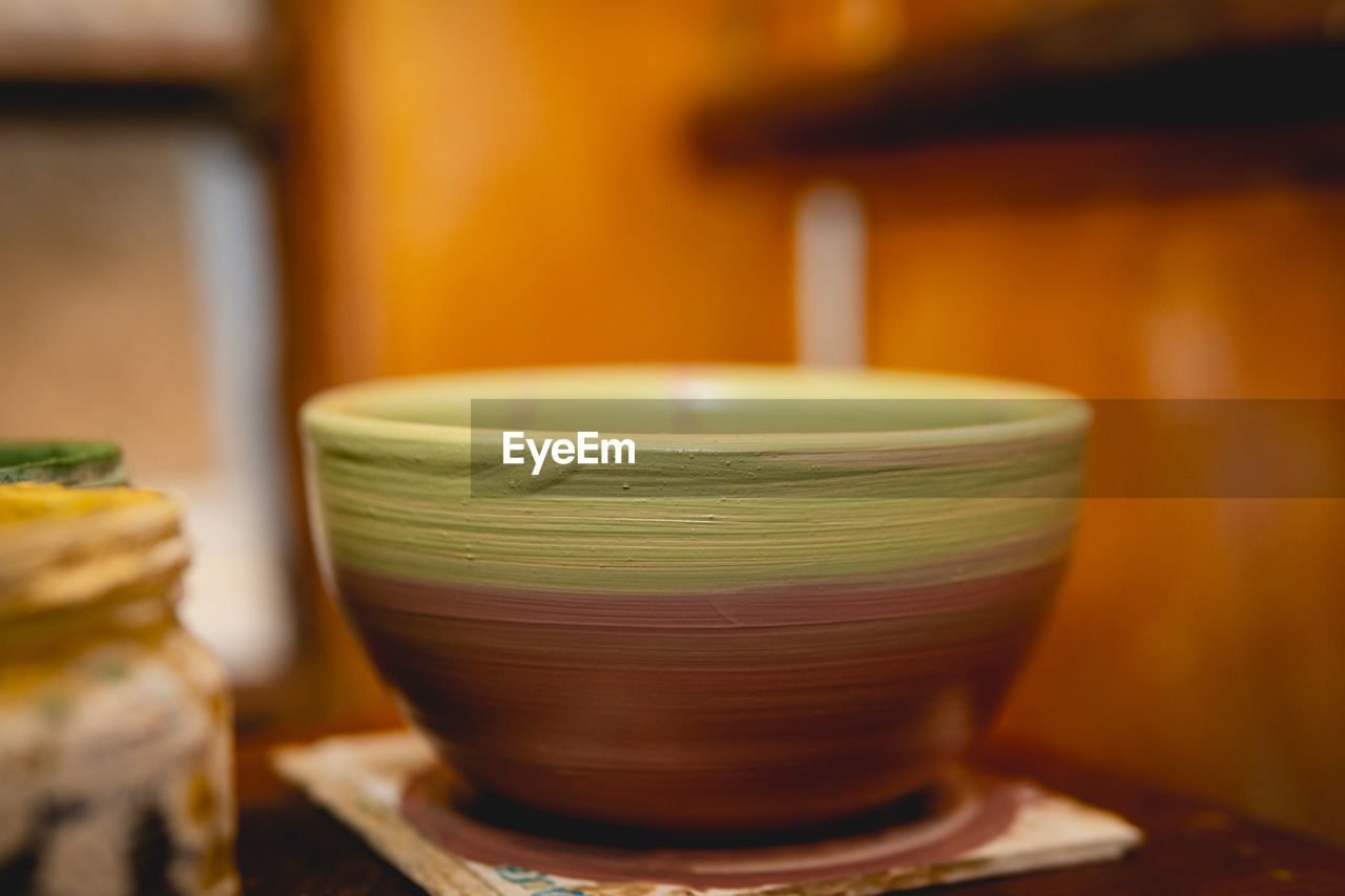 Close-up of earthenware on table