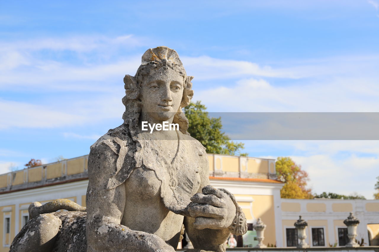 sculpture, statue, architecture, representation, human representation, monument, sky, craft, male likeness, history, built structure, the past, cloud, creativity, nature, ancient history, day, travel destinations, landmark, no people, art, temple, building exterior, memorial, outdoors, travel, religion, stone material, building, city, low angle view