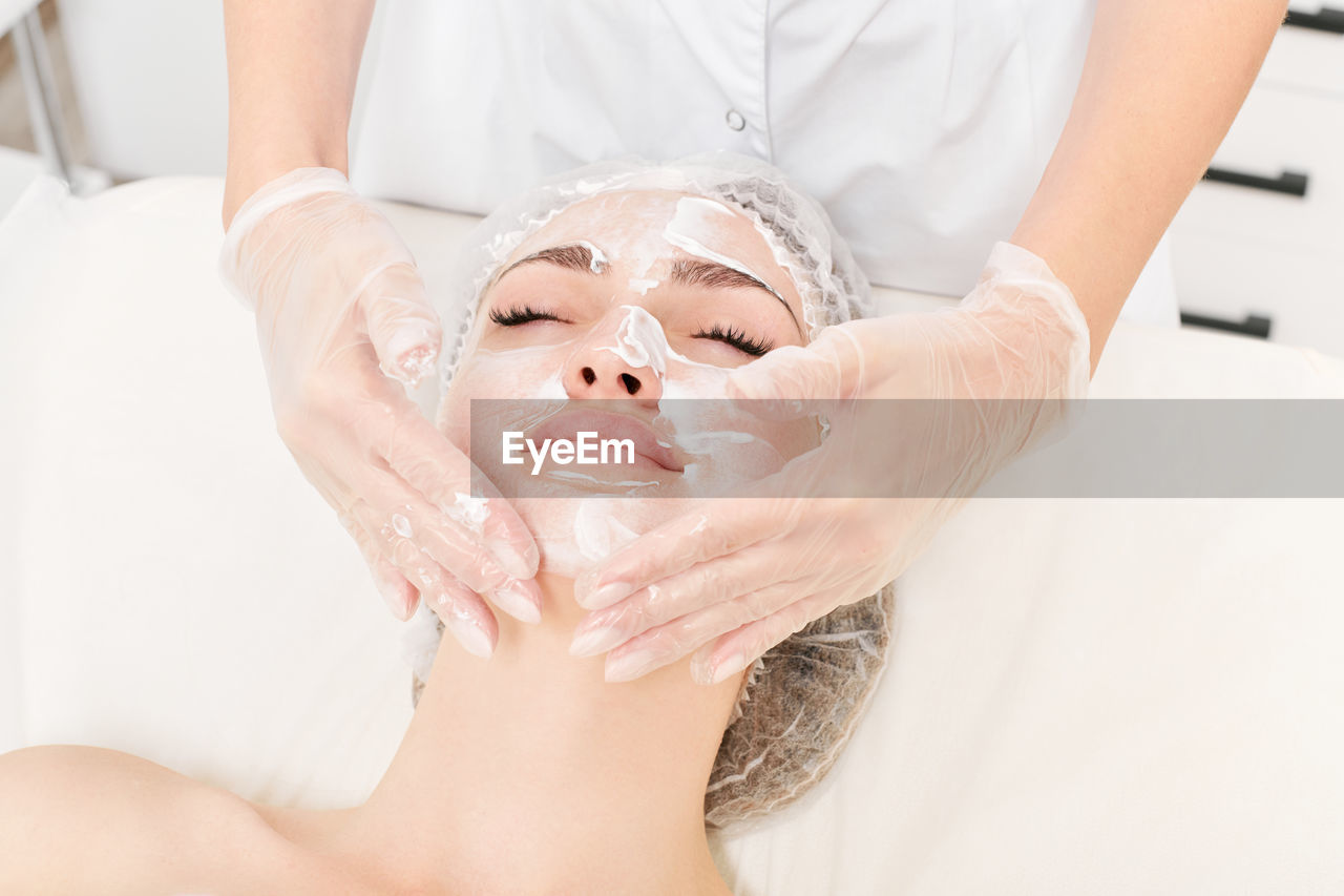 body care, beauty spa, skin, adult, spa treatment, women, beauty treatment, human face, wellbeing, relaxation, health spa, skin care, indoors, facial mask - beauty product, healthcare and medicine, human skin, hygiene, female, young adult, two people, hand, lying down, lifestyles, human head, exfoliation, massaging, applying, cleaning, person, towel, patient, portrait, white, care, spa, moisturizer, eyes closed, beauty product, body care and beauty, alternative therapy, medicine, doctor, therapy, food, occupation, professional occupation, headshot