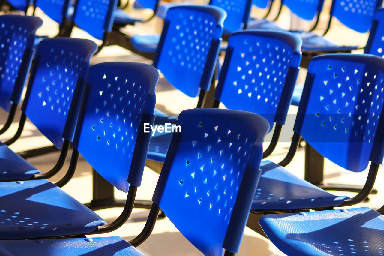 Arrangement of empty chairs in auditorium