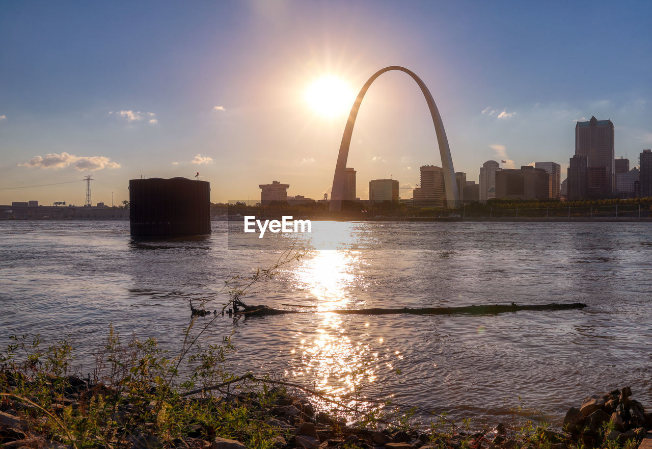 Scenic view of buildings against sky during sunset