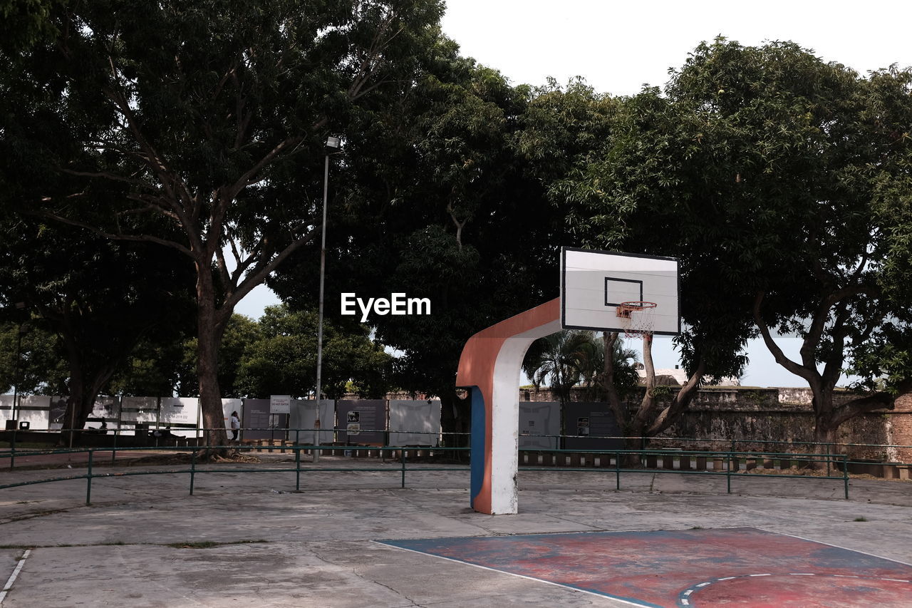 Basketball hoop against trees
