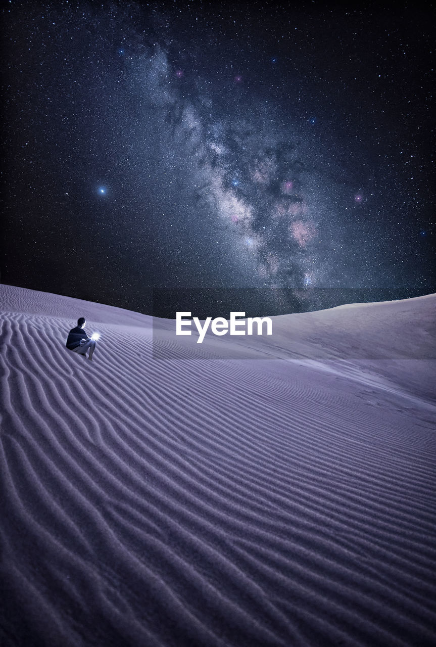Scenic view of star field against sky at night