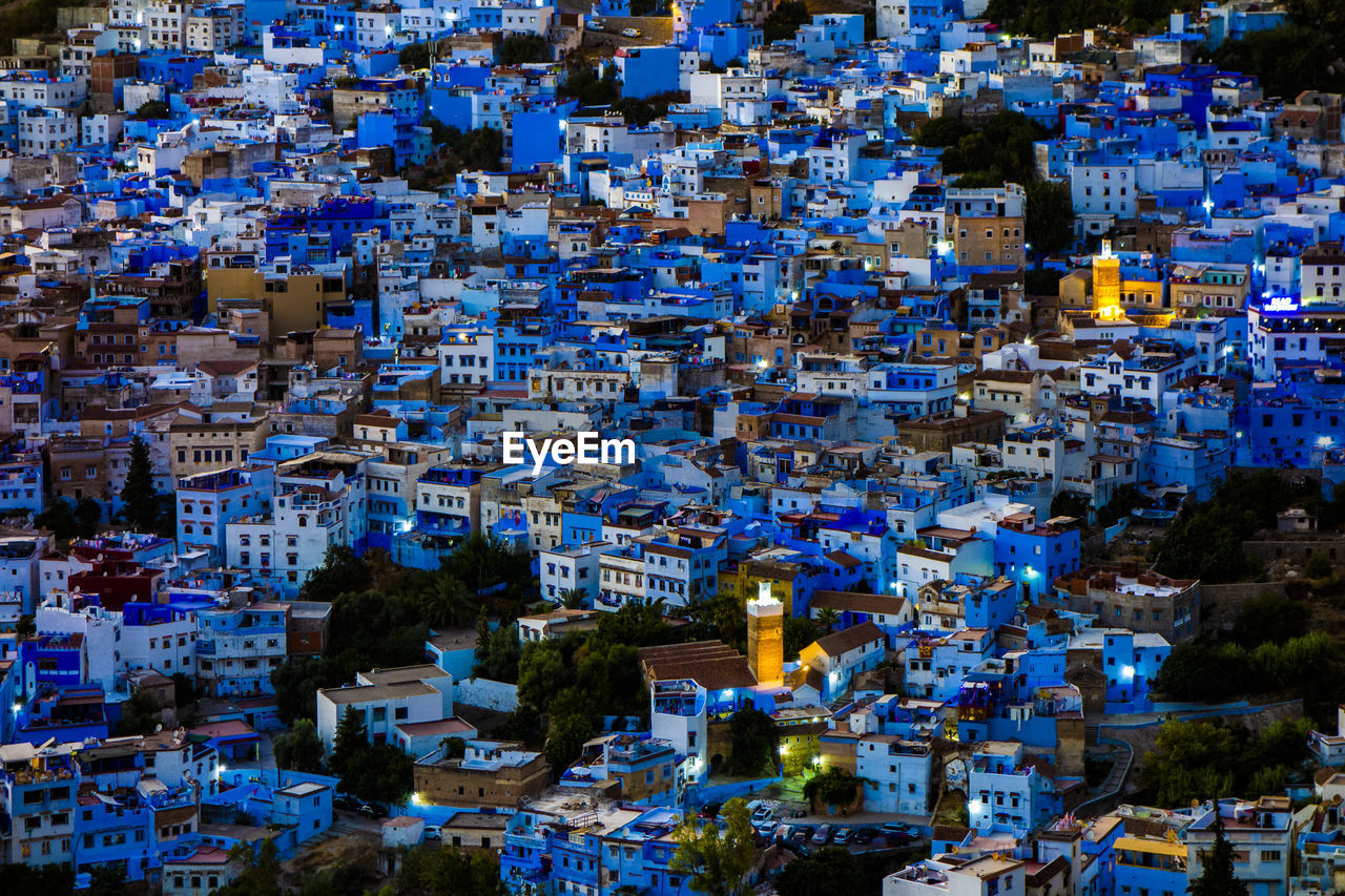 High angle view of illuminated buildings in city