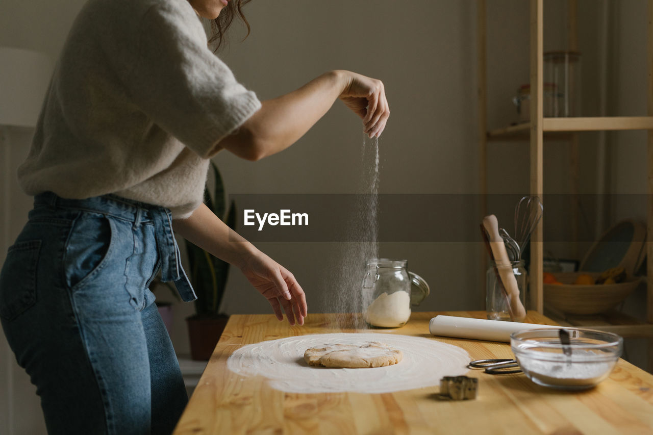 Young woman making christmas cookies