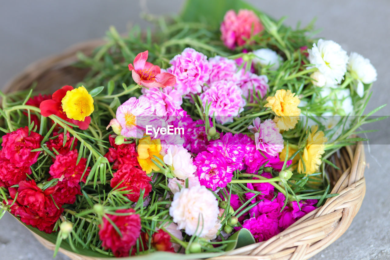 HIGH ANGLE VIEW OF FLOWERS ON BASKET