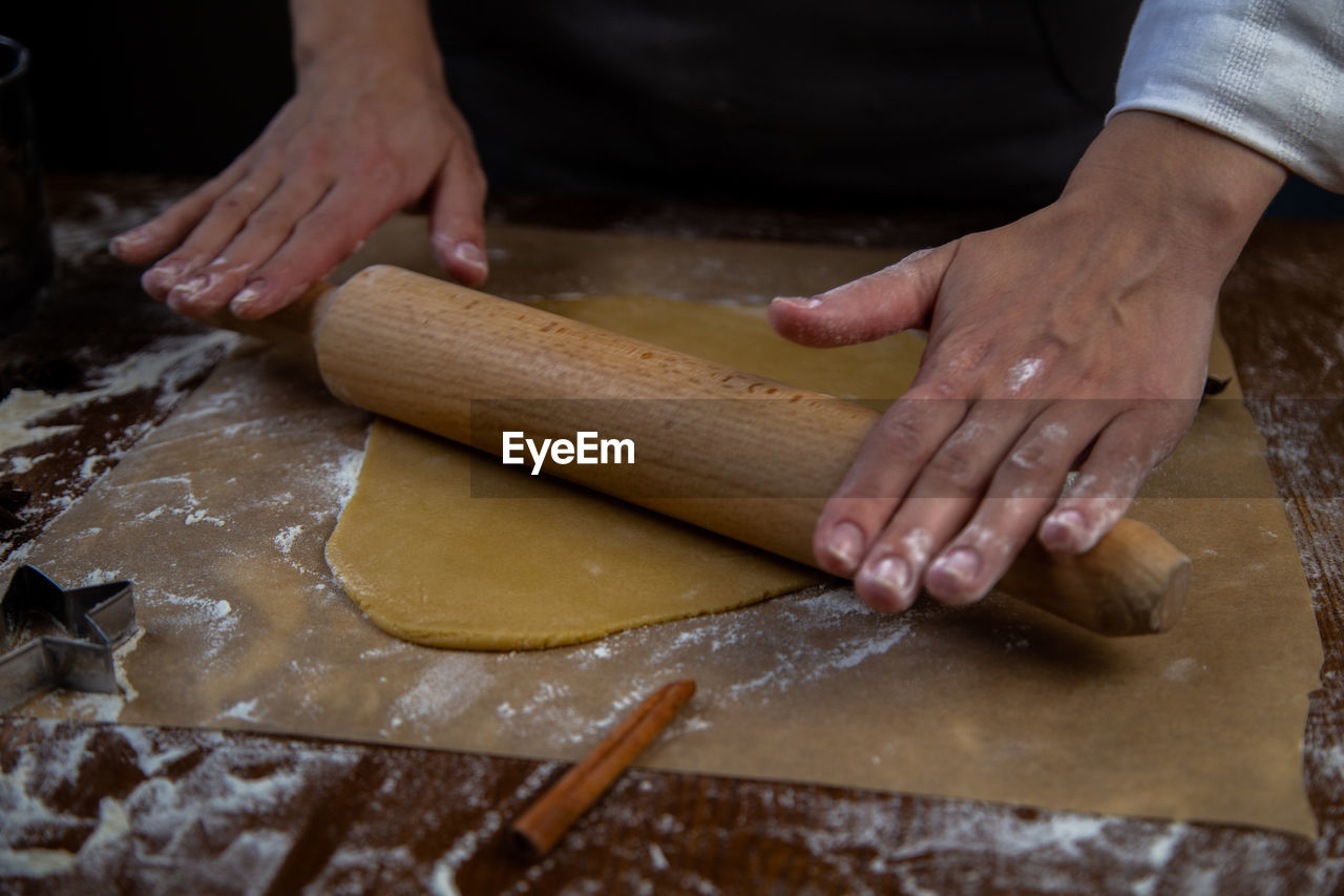 midsection of man working on table