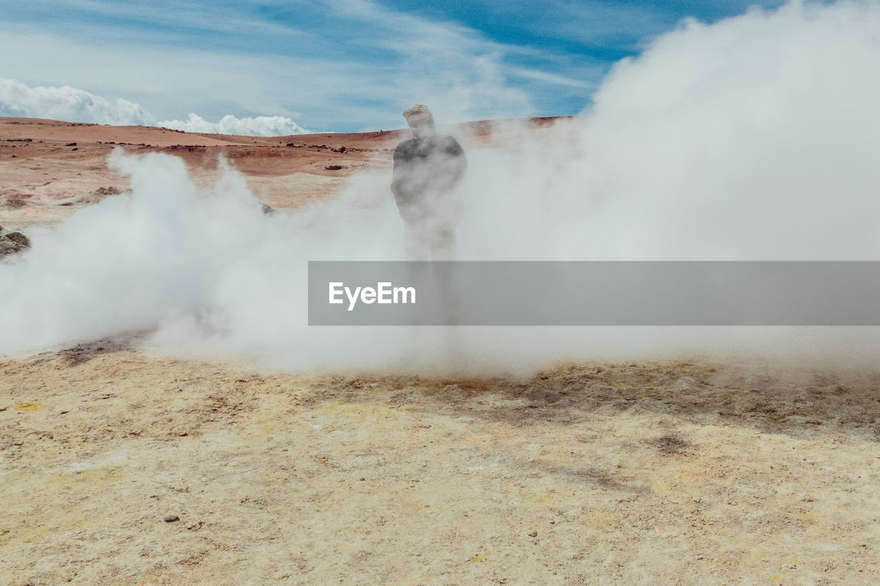 Man in smoke of hot spring