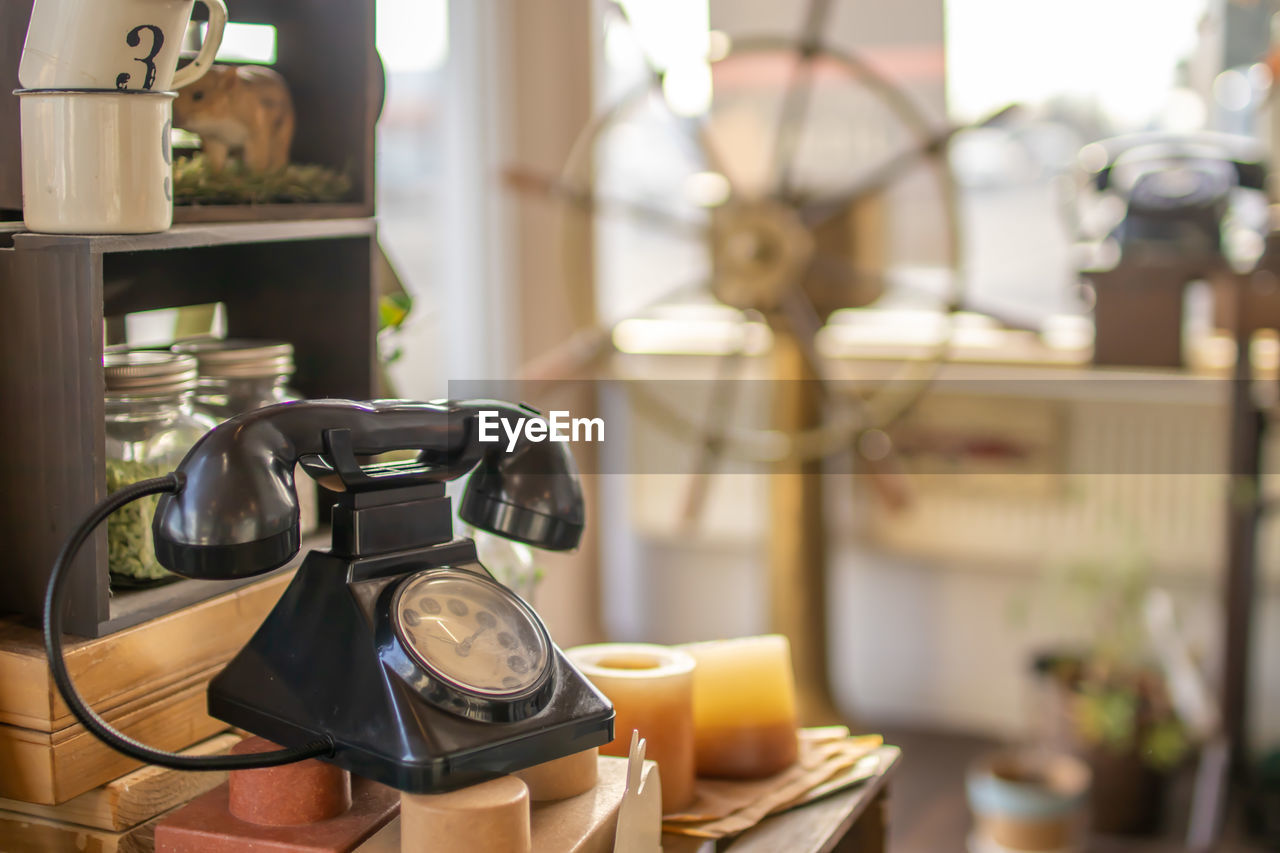 Close-up of telephone booth on table at home