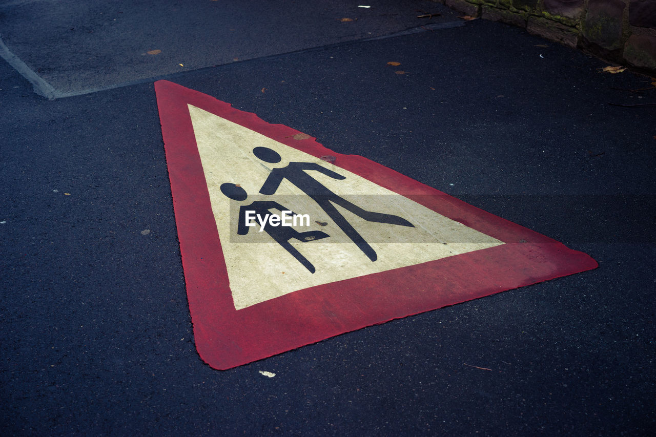 High angle view of sign on road