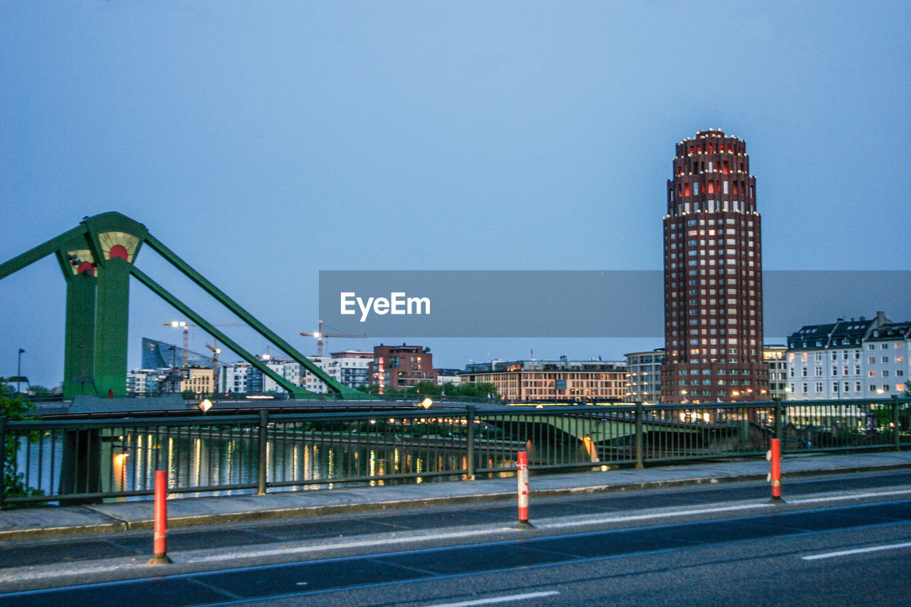 Bridge  in city against clear sky