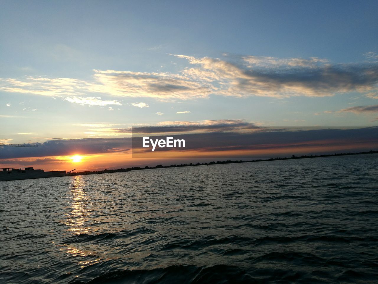 SCENIC VIEW OF SEA DURING SUNSET