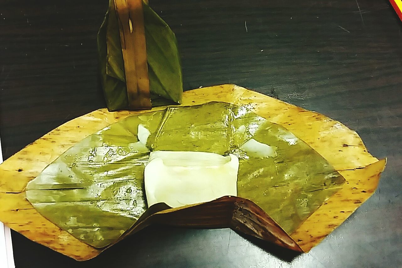 CLOSE-UP OF LEAVES ON TABLE