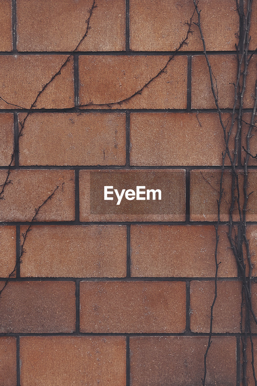 Full-frame background with a repeating symmetrical brick pattern