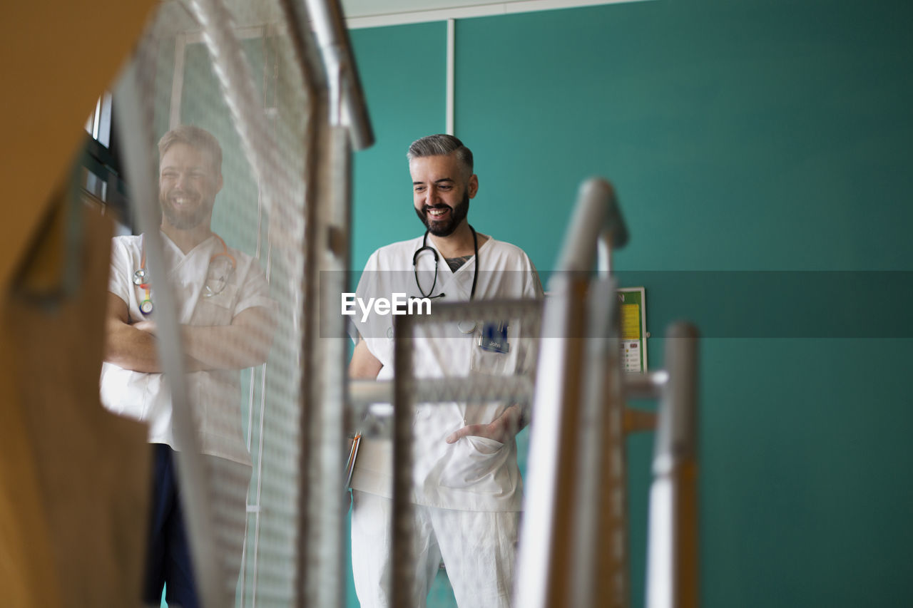 Doctors talking at hospital staircase