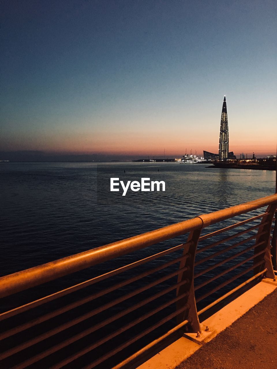 Scenic view of sea against clear sky during sunset