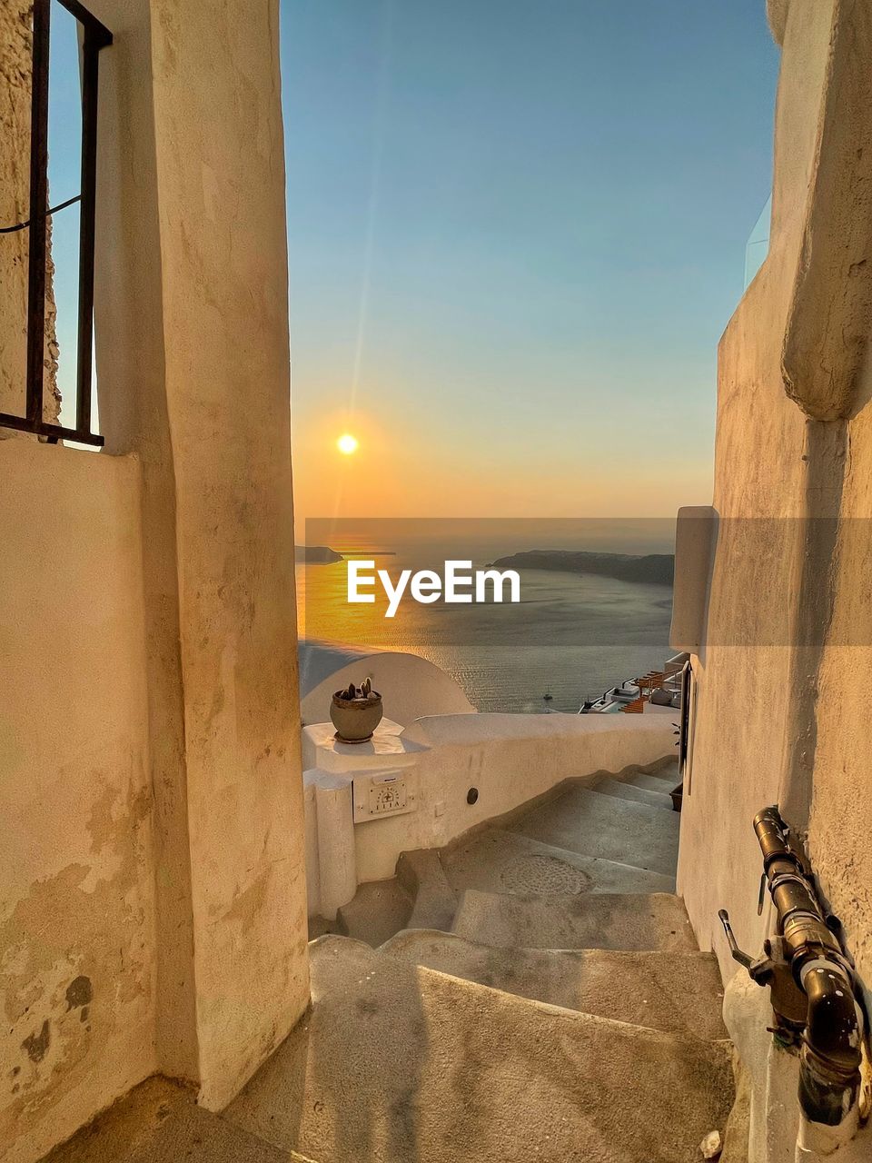 sky, sea, water, nature, architecture, sunset, sunlight, beach, land, scenics - nature, built structure, no people, horizon, horizon over water, tranquility, beauty in nature, outdoors, travel, wall, travel destinations, building exterior, clear sky, tranquil scene, transportation, wood, building, ancient history