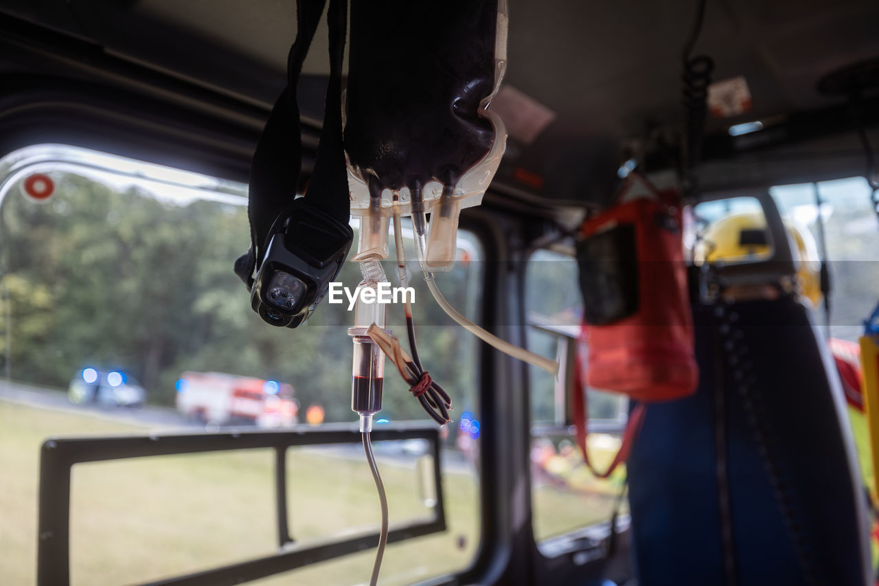 Transfusion bag with blood on board helicopter of air ambulance during flight. 