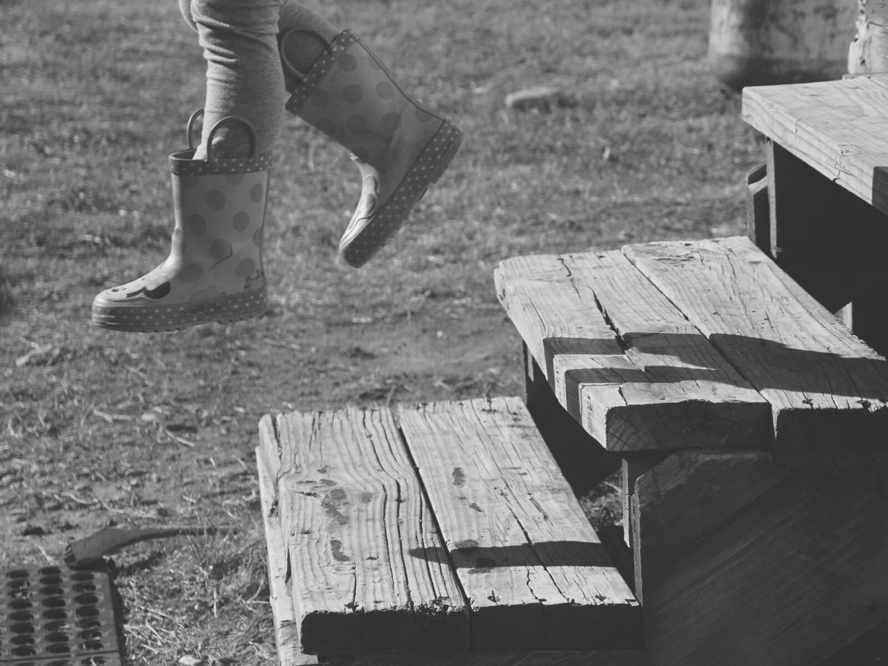 LOW SECTION OF PERSON ON WOODEN FLOOR